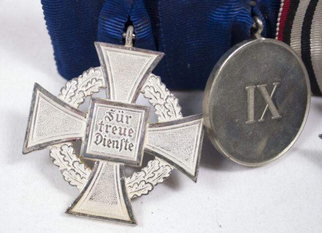 WWIWWII Medalbar with Hinterbliebene Kreuz, Kriegshilfskreuz, Treue Dienste bei der Fahne and Treue Dinest 25 Jahre Kreuz