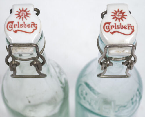 (Denmark) Two Carlsberg Beer bottles World War II with swastika bottle caps (1937 + 1932)
