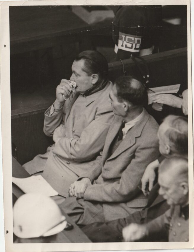 (Pressphoto) Nuremberg Trials Goering + Hess Goering has a cold