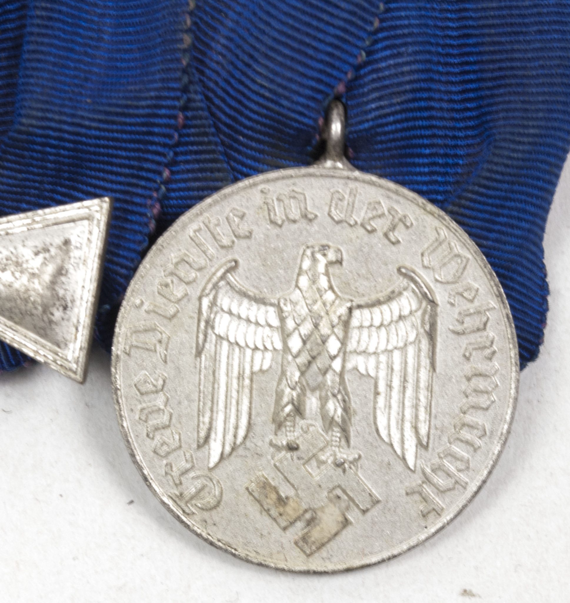 Wehrmacht (Heer) medalbar with 18 + 4 year long service medals