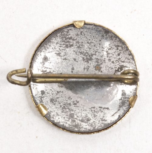 This is an early (pre-1933, pre-RZM) NSDAP sympathisers badge. It is made of celluloid.