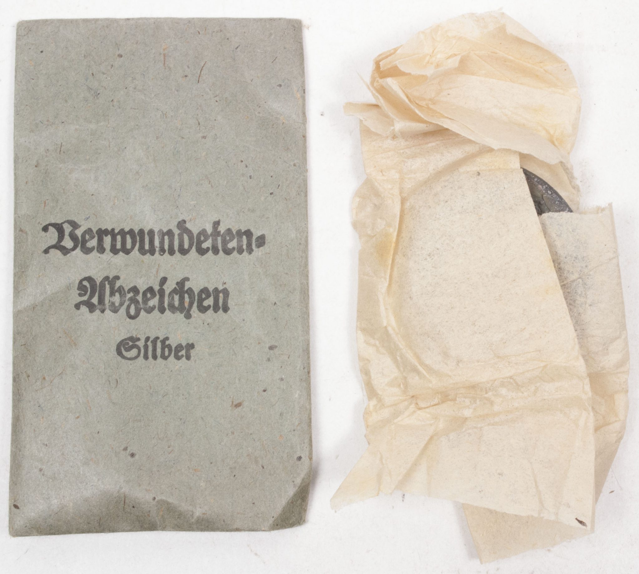 Verwundetenabzeichen Silber + Tüte (MM Steinhauer & Lück Lüdenscheid) – Unissued (5) Verwundetenabzeichen Silber + Tüte (MM Steinhauer & Lück Lüdenscheid) - Unissued