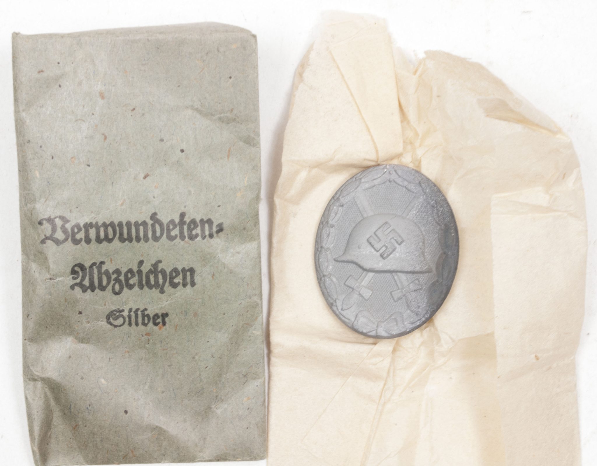 Verwundetenabzeichen Silber + Tüte (MM Steinhauer & Lück Lüdenscheid) - Unissued