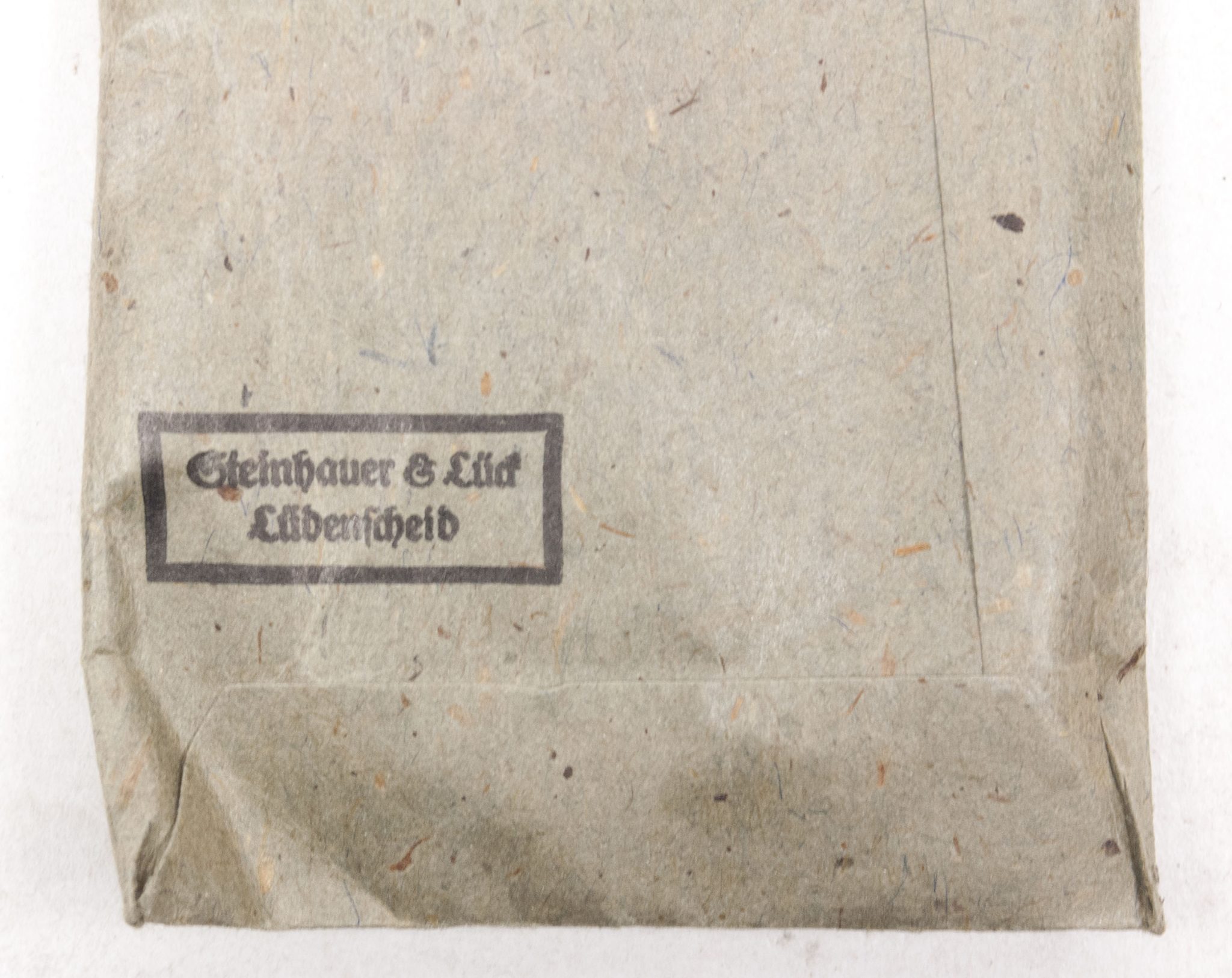 Verwundetenabzeichen Silber + Tüte (MM Steinhauer & Lück Lüdenscheid) - Unissued