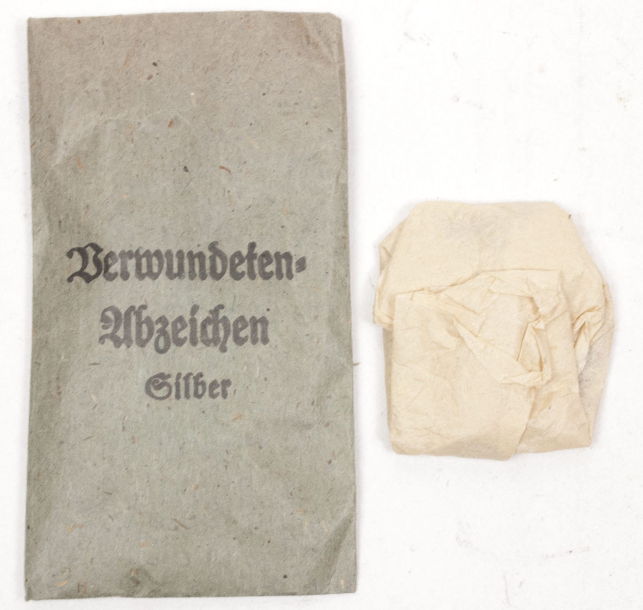 Verwundetenabzeichen Silber + Tüte (MM Steinhauer & Lück Lüdenscheid) - Unissued