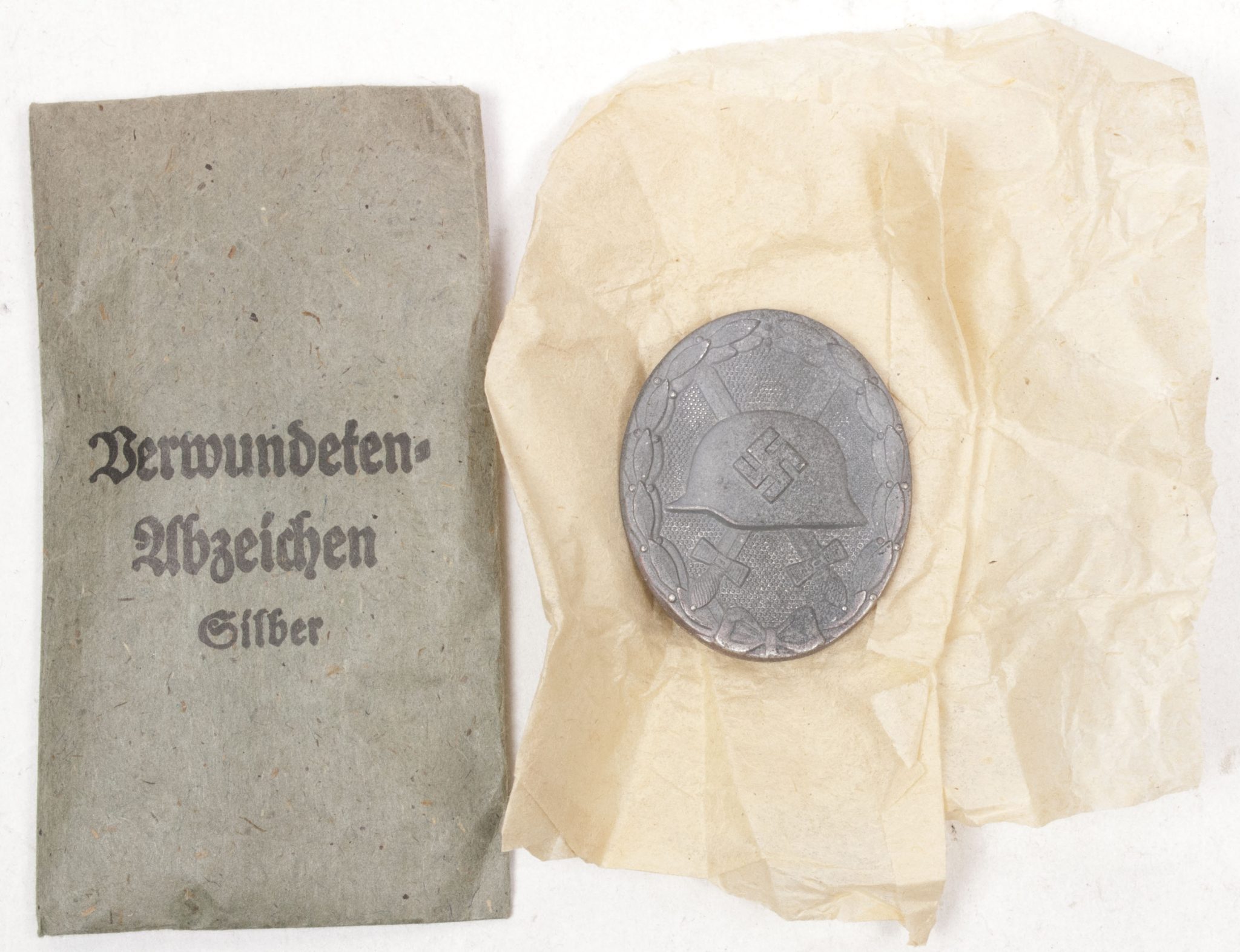Verwundetenabzeichen Silber + Tüte (MM Steinhauer & Lück Lüdenscheid) – Unissued (6) Verwundetenabzeichen Silber + Tüte (MM Steinhauer & Lück Lüdenscheid) - Unissued