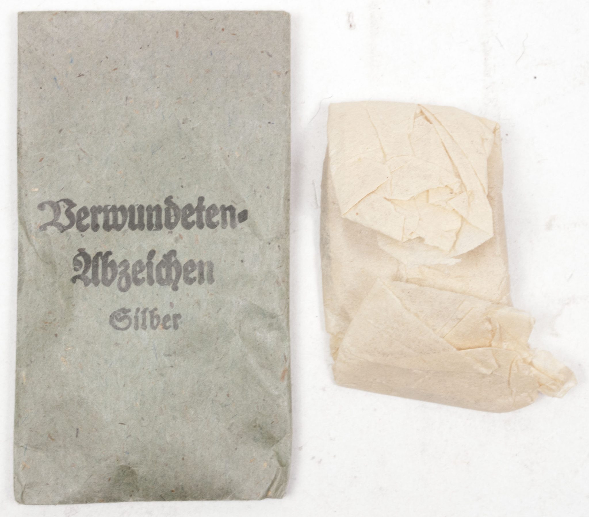 Verwundetenabzeichen Silber + Tüte (MM Steinhauer & Lück Lüdenscheid) - Unissued